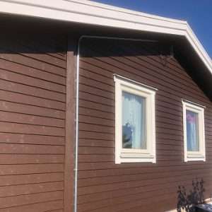 Byte av fjällpanel på fasad